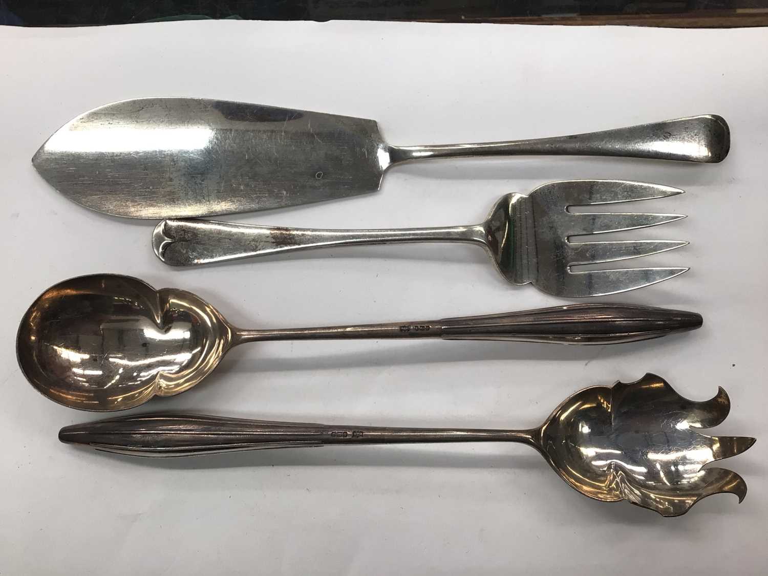 Pair of silver Mappin & Webb salad servers and a pair of silver fish servers