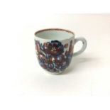 Bow coffee cup, painted in underglaze blue and iron red, circa 1760