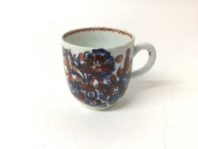 Bow coffee cup, painted in underglaze blue and iron red, circa 1760