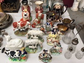 Collection of 19th century Staffordshire pottery to include spaniel, Toby jugs, cows and figures tog