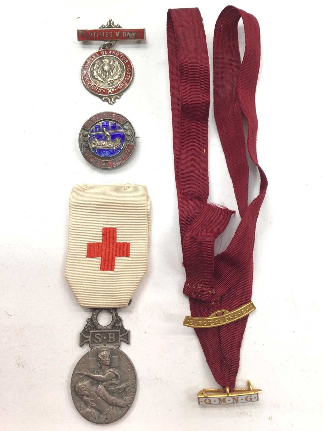 Small group of nursing badges and medals