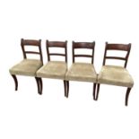 Set of four Regency mahogany dining chairs, each with tablet back and stuffover seats, on sabre legs