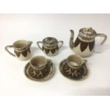 19th century Japanese Satsuma two-person tea set, with foliate and other patterns, four-character ma