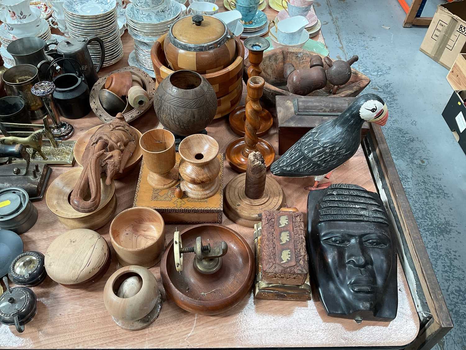 Group of treen items to include Puffin, barley twist candlesticks, nut cracker and other items.