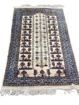 Eastern rug with geometric decoration on blue and cream ground, 148cm x 93cm