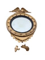 19th century convex wall mirror in gilt wood frame with ebonised slip and eagle surmount, approximat