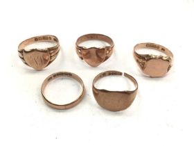 Four 9ct rose gold signet rings and 9ct rose gold wedding ring (5)