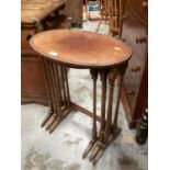 Edwardian mahogany nest three oval coffee tables on colomn supports