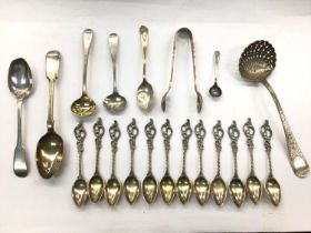 Group of silver and white metal spoons and pair of silver sugar tongs, in a brass inlaid box