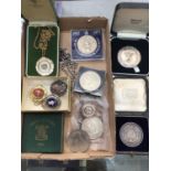 Two silver medallions in fitted cases, silver fob on plated chain, other fobs and coins