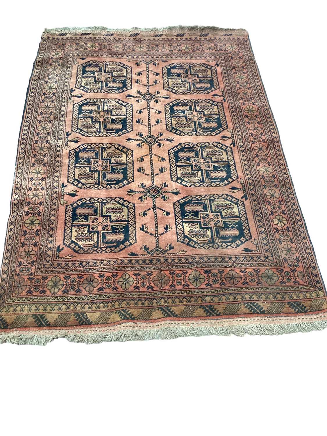 Eastern rug with eight medallions on red ground, 190cm x 135cm