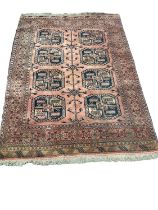 Eastern rug with eight medallions on red ground, 190cm x 135cm