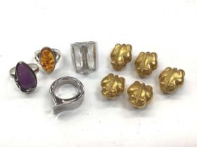 Two silver gem set rings, one other silver ring, Swarovski crystal ring and five gilt frog buttons