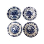 Four 18th century blue and white Delft plates