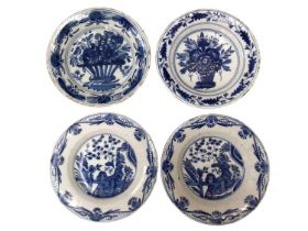 Four 18th century blue and white Delft plates