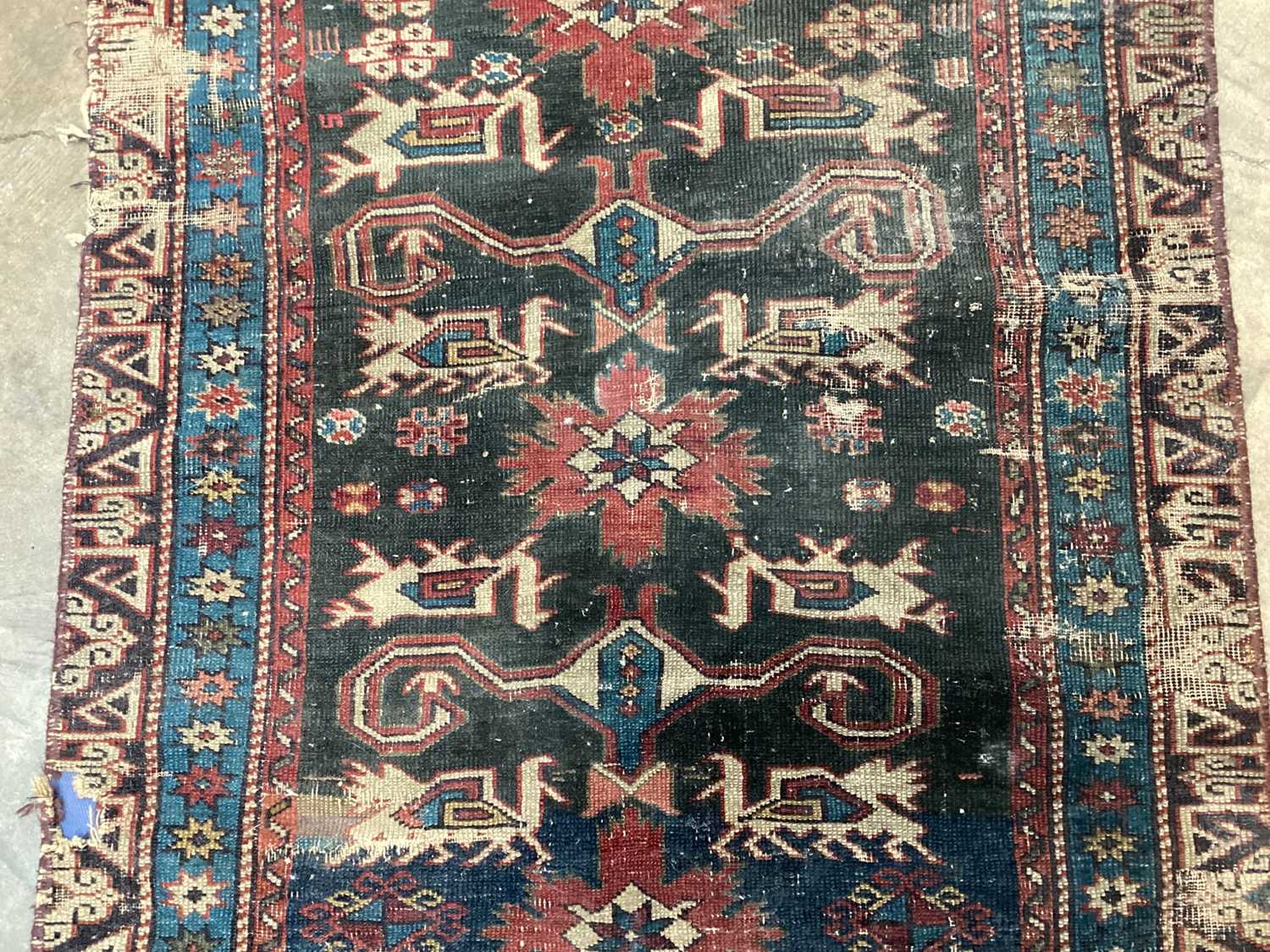 Eastern rug with geometric decoration on red, blue and black ground, 135cm x 72cm - Image 3 of 5