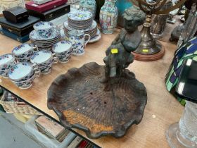 Cast metal garden bird bath modelled as a cherub in a shell