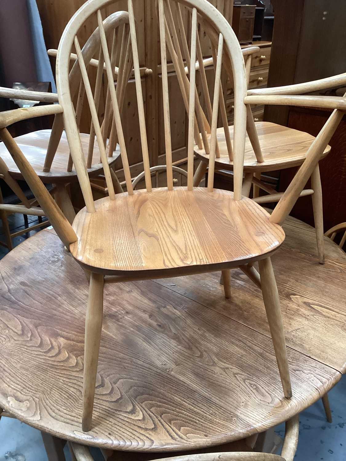Ercol elm oval dropleaf kitchen table opening to 127 x 141cm and seven Ercol stick back chairs compr - Image 3 of 3