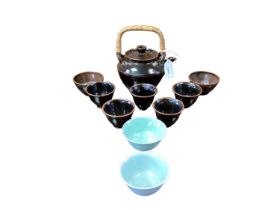 Yeap Poh Chap (1927-2007) teapot with cane handle and nine assorted tea bowls, all signed. (10)