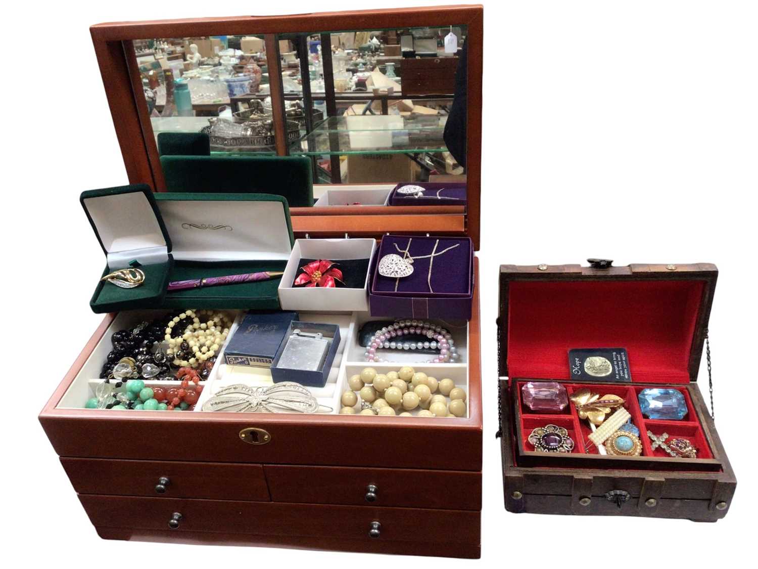 Two jewellery boxes containing costume jewellery, simulated pearls, brooches and various coins