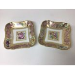 Pair of Sèvres shaped dishes, polychrome painted with floral sprays, on a pink and gilt ground
