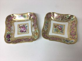 Pair of Sèvres shaped dishes, polychrome painted with floral sprays, on a pink and gilt ground
