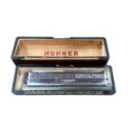 Hohner Chromonica in fitted case, cigarette cards, postcards, packs of playing cards, two children's