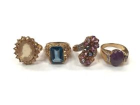 Four 9ct gold multi-gem set cocktail rings