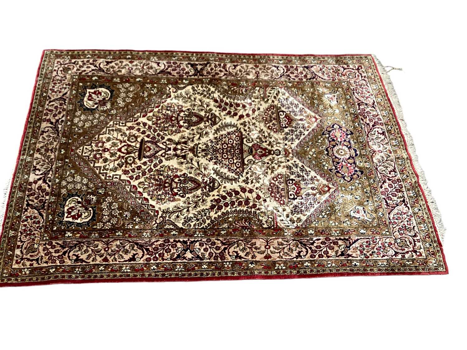 Eastern rug with floral decoration on red, cream and green ground, 154cm x 108cm