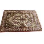 Eastern rug with floral decoration on red, cream and green ground, 154cm x 108cm