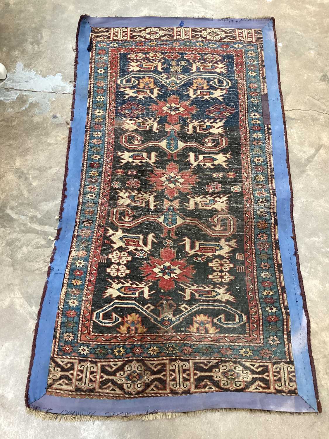 Eastern rug with geometric decoration on red, blue and black ground, 135cm x 72cm - Image 5 of 5