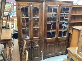 Old Charm oak corner cupboard with leaded glazed doors and similar display cabinet, both with linen