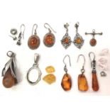 Small group of silver and white metal mounted amber earrings and pendants