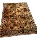 Eastern rug with ten medallions on rust brown ground, 212cm x 138cm