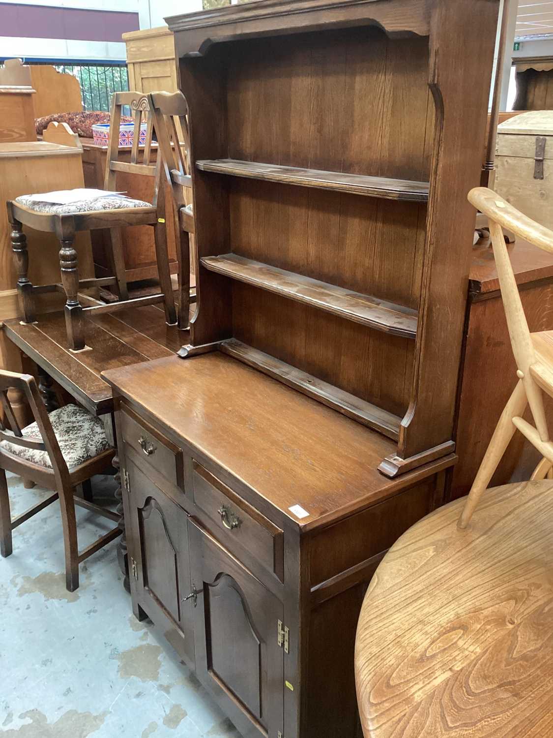 Reprodux oak dresser with raised back, two drawers and two panelled doors 173cm high, 92cm wide