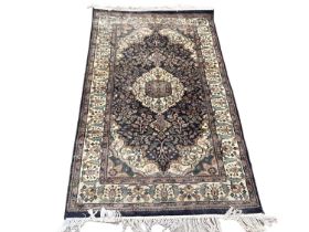 Eastern rug with central medallion on blue and cream ground, 150cm x 87cm, together with another rug