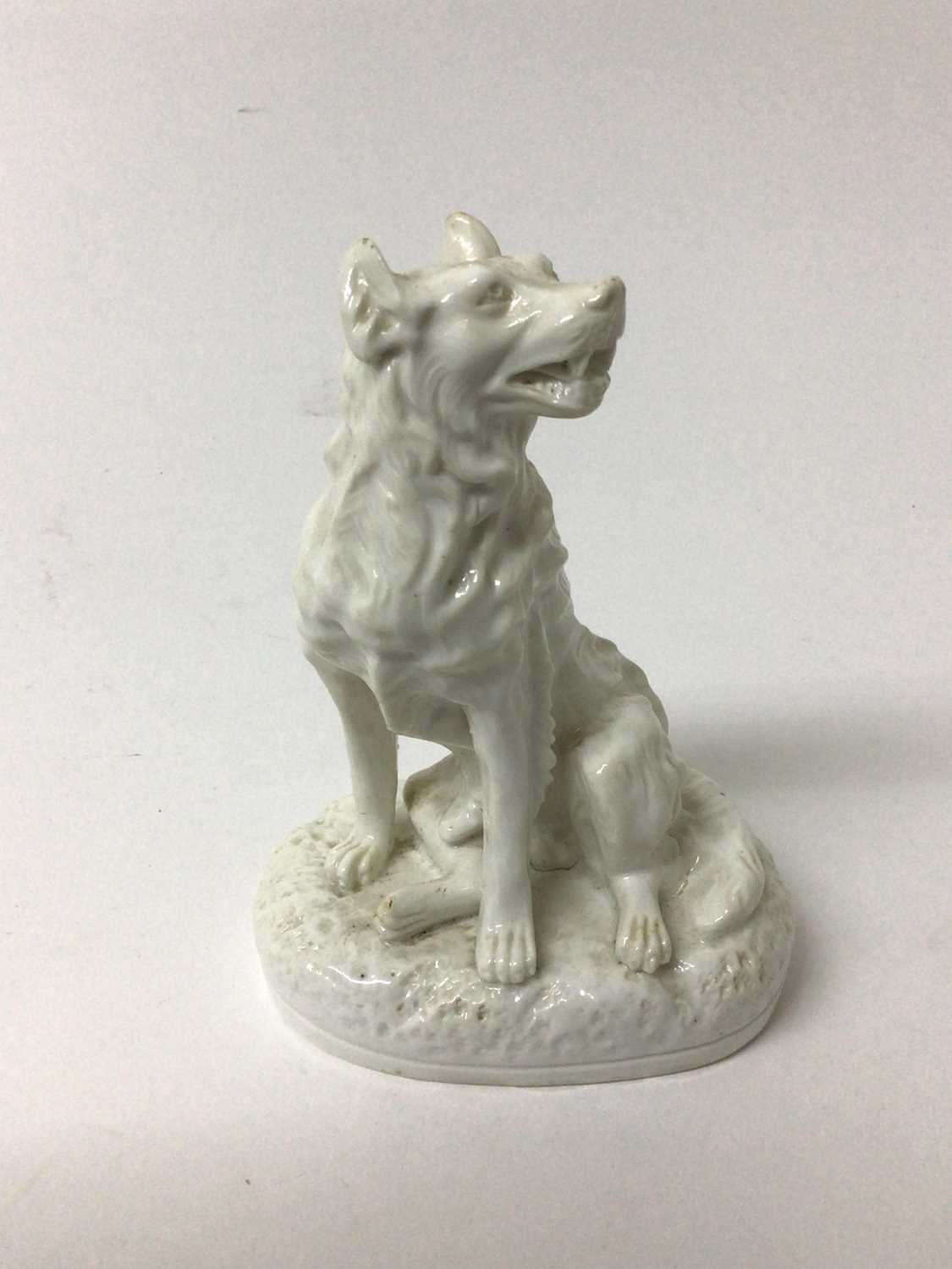 Derby Stephenson & Hancock white glazed model of a dog, shown seated on an oval base, inscribed mark