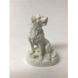 Derby Stephenson & Hancock white glazed model of a dog, shown seated on an oval base, inscribed mark