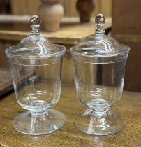 Pair of contemporary glass urns and covers