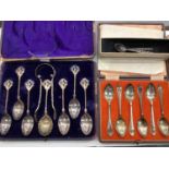 Two sets of silver teaspoons in fitted cases, other white metal spoons and some plated flatware