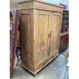 19th century pine double wardrobe with two drawers below on bun feet 150 cm wide, 198cm high, 58cm d