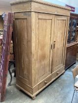 19th century pine double wardrobe with two drawers below on bun feet 150 cm wide, 198cm high, 58cm d