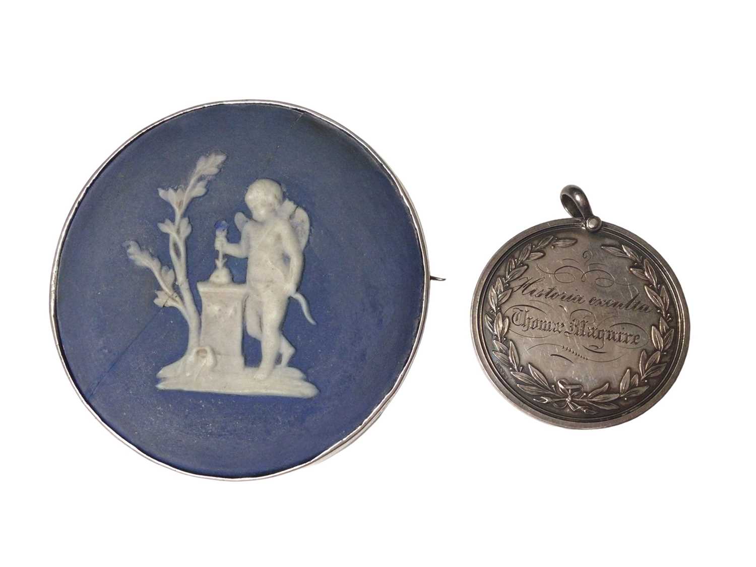 Jasperware porcelain disc in a white metal brooch mount and a white metal medallion dated 1844