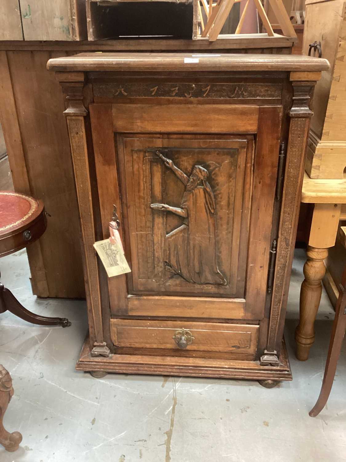 18th century Swiss walnut cupboard dated 1731 and with AM initials, the door carved with Jewish bibl