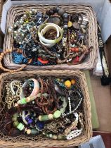 Three baskets containing costume jewellery and bijouterie