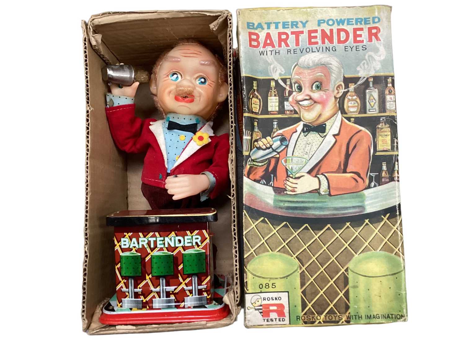 Rosko Battery operated Bartender with revolving eyes, in original box, plus a Cragstan Crapshooter b