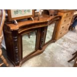 Regency rosewood serpentine cabinet with mirrored doors