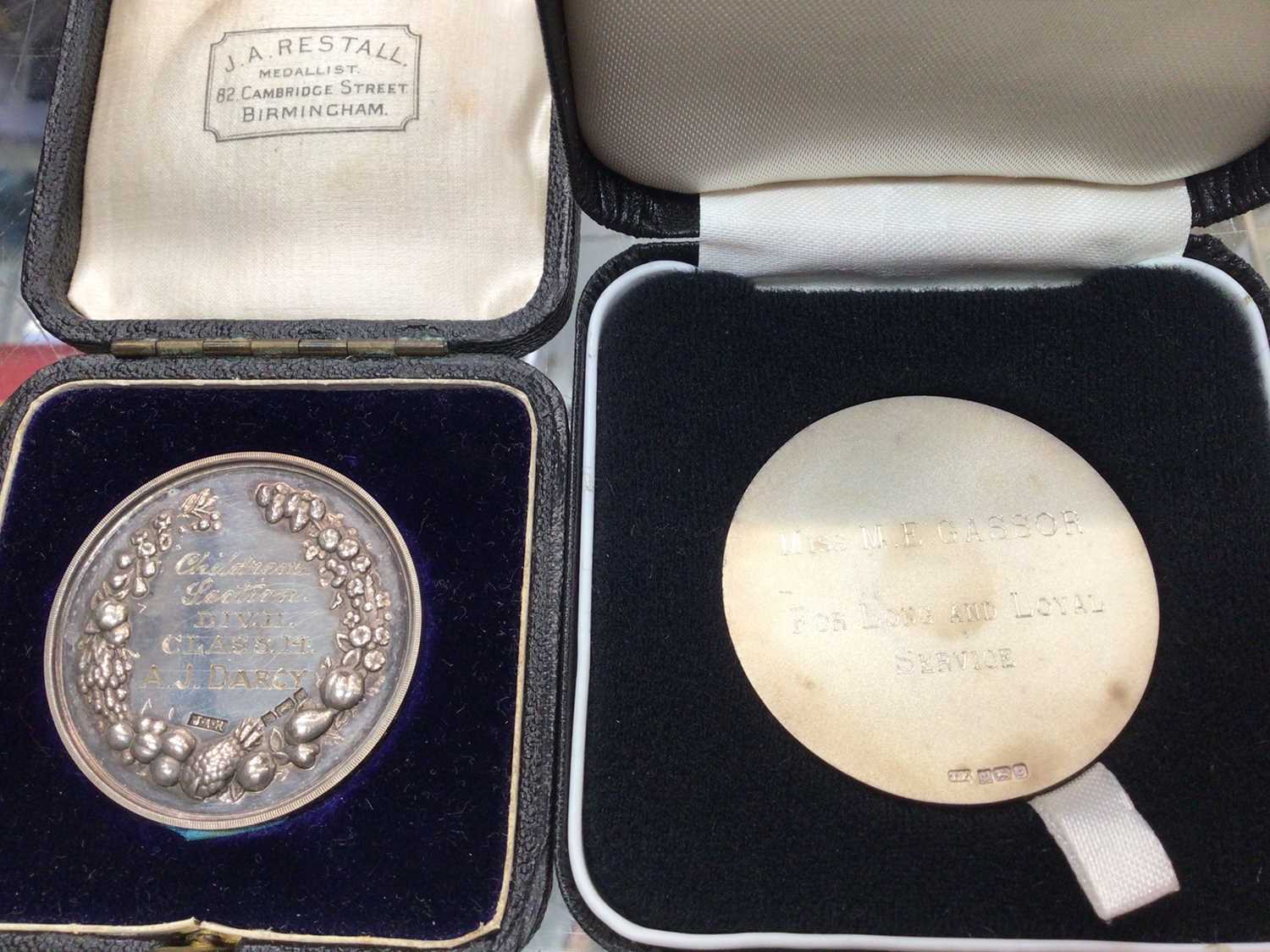 Two silver medallions in fitted cases, silver fob on plated chain, other fobs and coins - Image 3 of 3