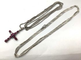 Long white metal guard chain with a silver mounted gem set cross pendant and a white metal flat curb