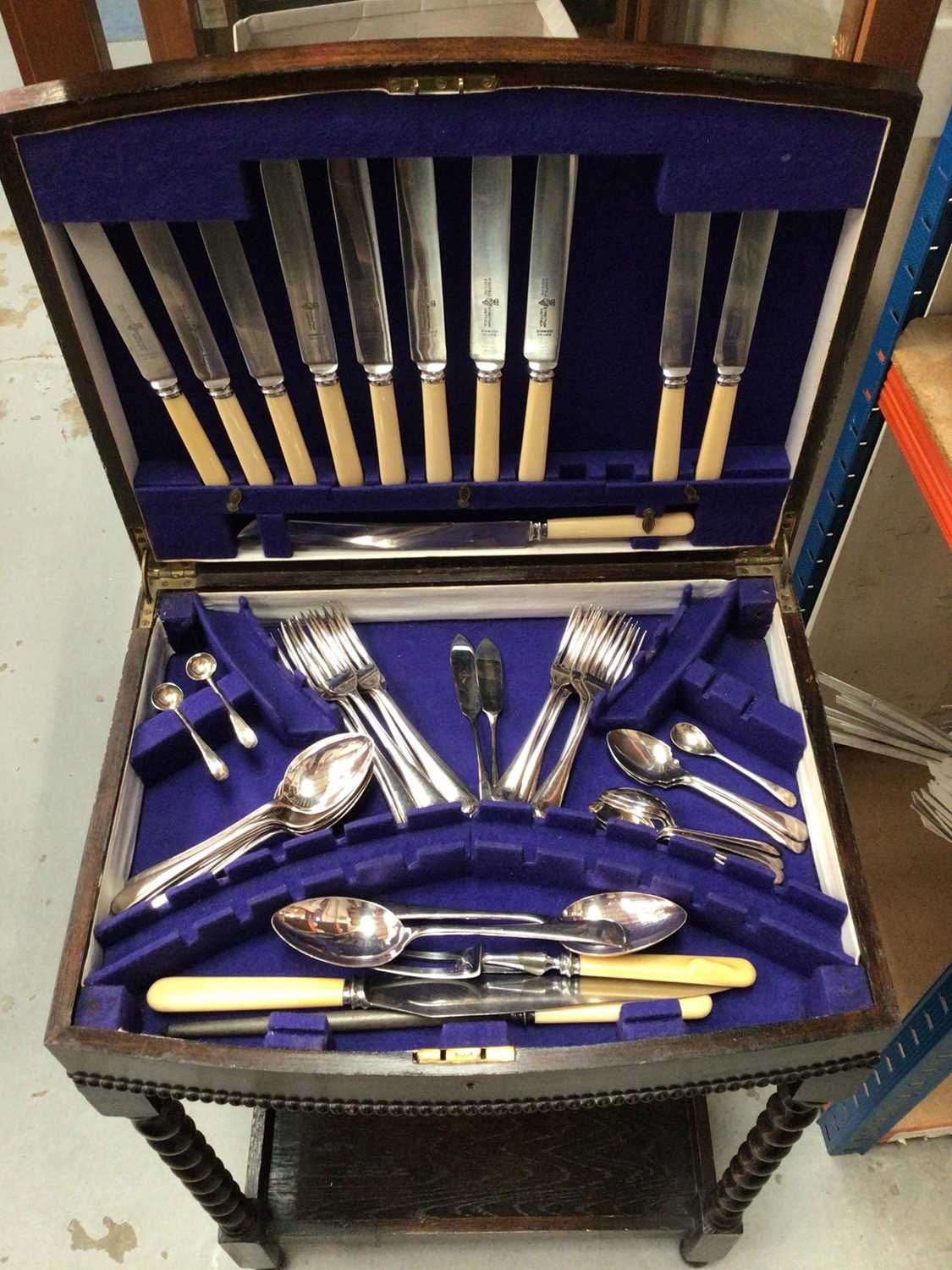 Canteen of plated cutlery in an oak case on four barley twist legs